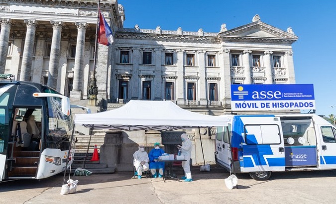 A mobile medical unit performs COVID-19 test in front of Parliament, Montevideo, Uruguay, Dec. 14, 2020.