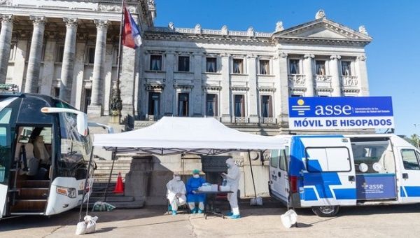 A mobile medical unit performs COVID-19 test in front of Parliament, Montevideo, Uruguay, Dec. 14, 2020.