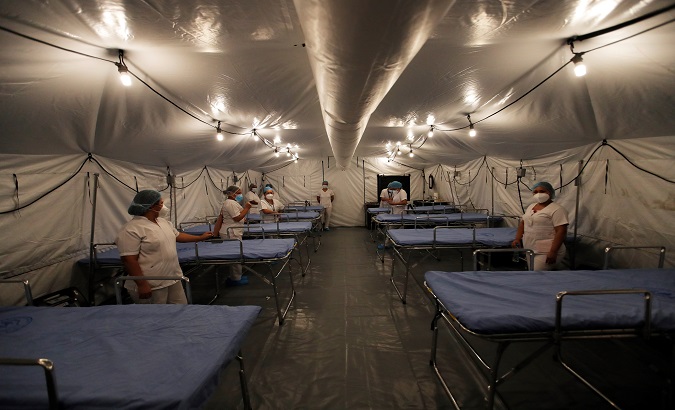 A medical staff prepares to receive patients with COVID-19, La Chorrera, Panama, Dec. 20, 2020.