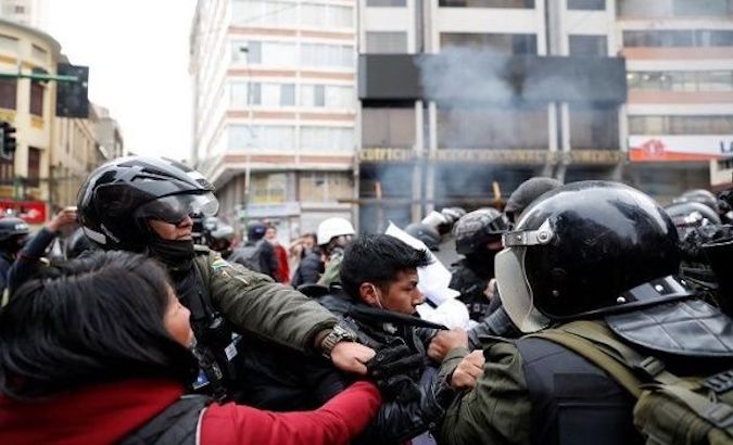 Police repress a protest against the coup-born regime, La Paz, Bolivia, Nov. 14, 2019.
