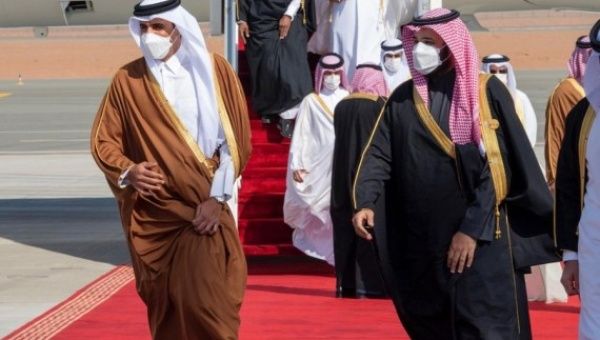 Saudi Arabia's Crown Prince Mohammed bin Salman Al Saud (R) welcomes Qatari Emir Sheikh Tamim bin Hamad Al Thani to attend the 41st Gulf Cooperation Council (GCC) Summit in Al-Ula, Saudi Arabia, Jan. 5, 2021.