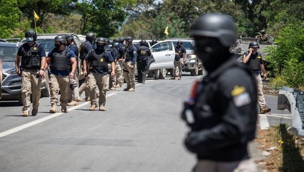 Members of the Investigative Police carry out an operation, Ercilla, Chile, Jan. 7, 2021.