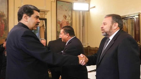 President Nicolas Maduro (L) greets lawmaker Timoteo Zambrano (R) during a meeting with opposition figures, Caracas, Venezuela,  March. 3, 2020.