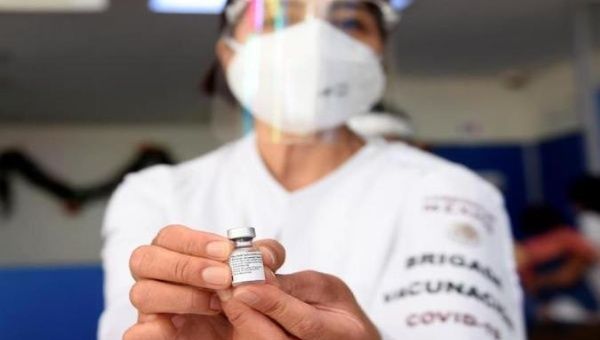 Health worker shows a dose of COVID-19 vaccine, Morelos, Mexico, Jan. 13, 2021. 