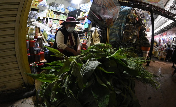 A shopkeeper sells medicinal plants at the Calatayud market, Bolivia, Jan. 21, 2021.