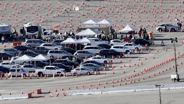 Motorists line up to receive inoculation at a COVID-19 vaccination site at Dodger Stadium, Los Angeles, U.S., Jan. 15, 2021. 