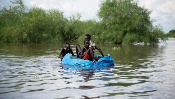 People amid a flooding, South Sudan, 2020. 