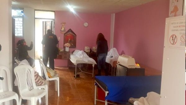 Patients await at the clandestine clinic to get a dose of the fake COVID-19 vaccine in Quito, Ecuador. Jan. 26, 2021.