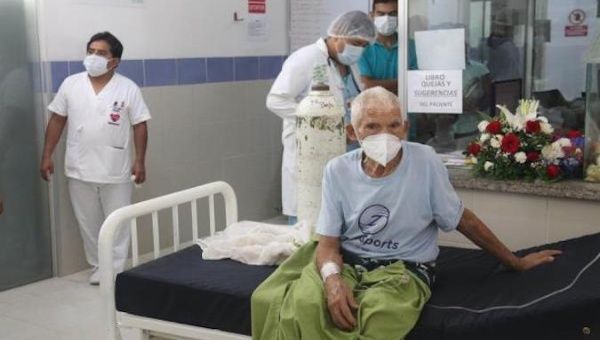 An elderly man waits to be admitted to a hospital in Santa Cruz, Bolivia, Jan. 25, 2021. 