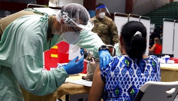 A woman receives the Moderna COVID-19 vaccine in San Juan, Puerto Rico, Jan. 22, 2021.