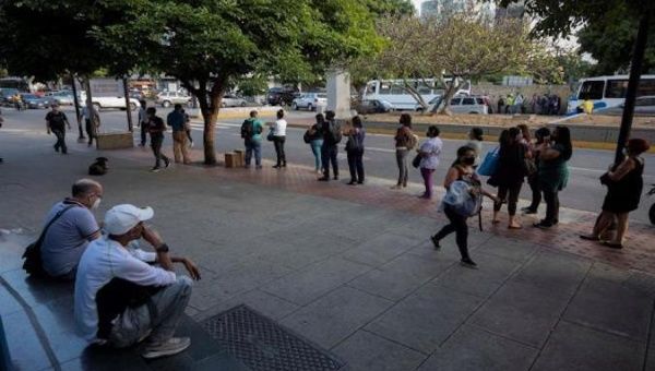 People waiting for public transportation, Caracas, Venezuela, Feb. 8, 2021.