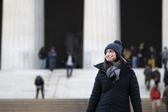 A woman wearing a face mask visits the Lincoln Memorial in Washington, D.C., the United States, Jan. 24, 2021.