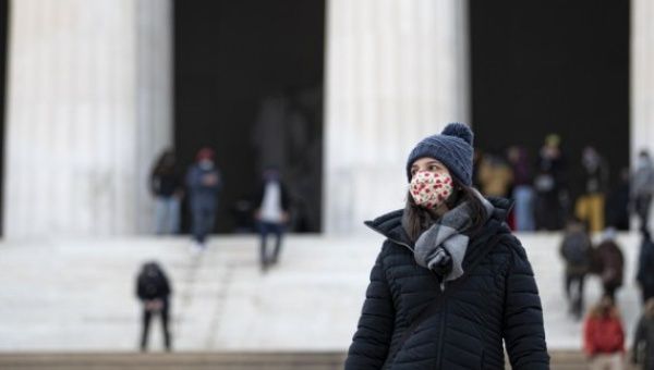 A woman wearing a face mask visits the Lincoln Memorial in Washington, D.C., the United States, Jan. 24, 2021.