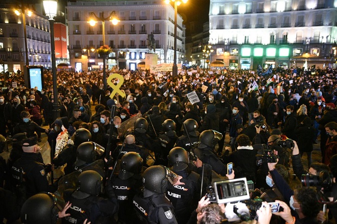 Demonstrators clash with security forces in Madrid, Spain on February 17, 2021.