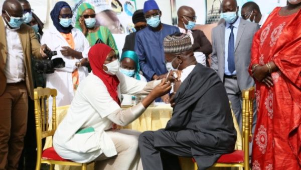Former Senegalese Prime Minister Souleymane Ndene Ndiaye is being vaccinated with China's Sinopharm COVID-19 vaccine on Feb. 23, 2021, in Dakar, Senegal.