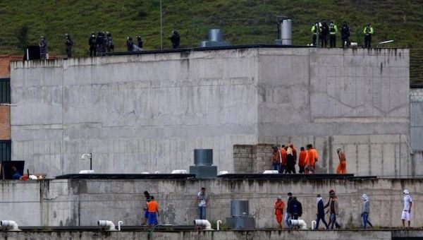 Inmates on the roof of El Turi jail in Cuenca, Ecuador, Feb. 24, 2021.