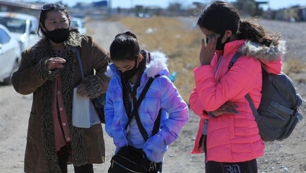 A Honduran family seeking asylum walks to the U.S., Ciudad Juarez, Mexico, Feb. 8, 2021.