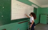 A girl answers exercises on the blackboard, Aragua, Venezuela, March 1, 2021.