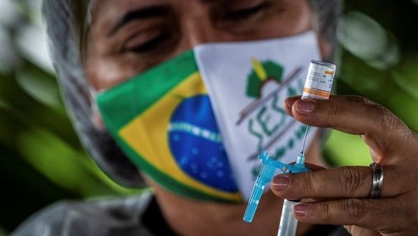 Nurse prepares a Coronavac vaccine, Autazes municipality, Amazonas state, Brazil, Feb. 5, 2021.