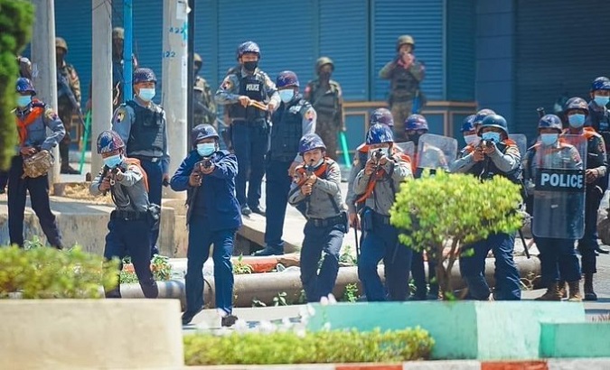 Police group attack unarmed citizens  in Taungyi, Myanmar, March 2, 2021.