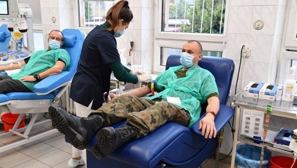 A soldier donates blood plasma in Radom, Poland, Nov. 10, 2020.