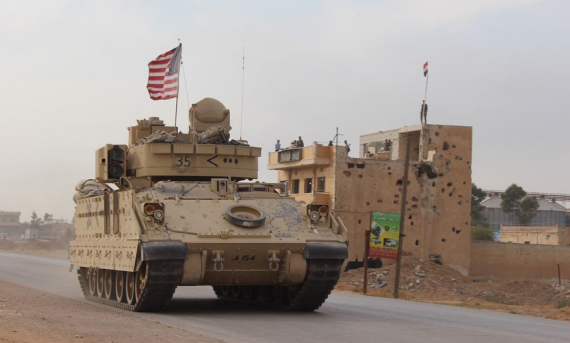 A U.S. military vehicle is seen passing through the Tal Tamr area in the countryside of Hasakah Province in northeastern Syria on Nov. 14, 2019.