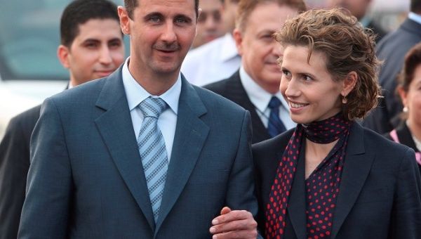 Archival image of Syrian President Bashar al-Assad (L) with his wife Asma al-Assad at New Delhi International airport, India. The Syrian Presidency has announced that the couple has tested positive for the SARS-CoV-2 coronavirus. 