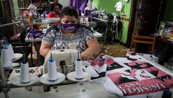 Women working in a sewing workshop, Montevideo, Uruguay, March 6, 2021.