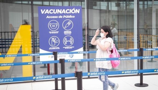 A woman goes to a vaccination center in Montevideo, Uruguay. March 20, 2021.