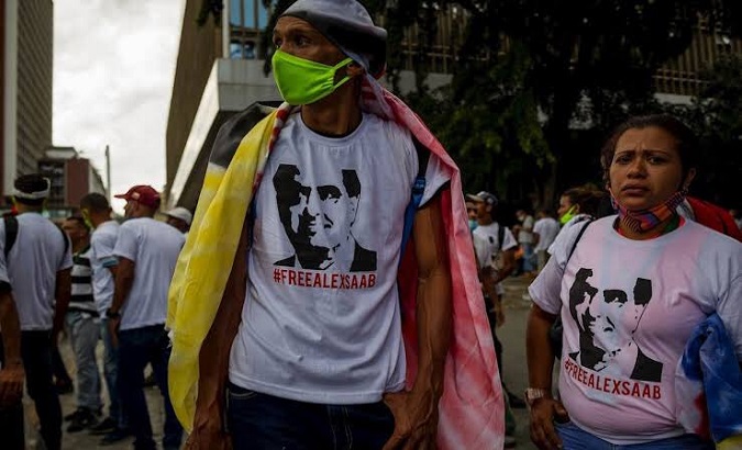 People wear T-shirts asking for Alex Saab's release, 2021.