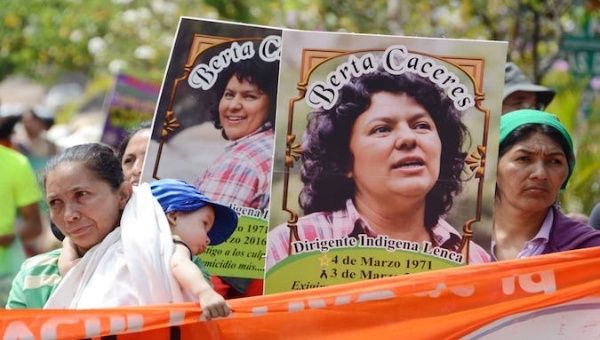People holding pictures of environmental activist Berta Caceres, Tegucigalpa, Honduras.