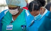 Health workers at an event to commemorate the 1st anniversary of the COVID-19 outbreak, Miami, U.S., March 19, 2021.