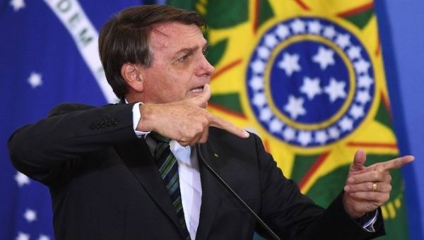 President Jair Bolsonaro talks about guns in Brasilia, Brazil. 