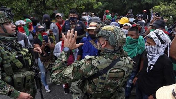 Soldiers stop the Indigenous march in Cali, Colombia, May 9, 2021.