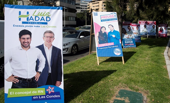 Electoral advertising posters on a street in Santiago, Chile, Apr. 29, 2021.