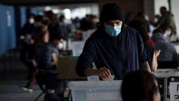 A man exercises his right to vote during a constitutional referendum, Santiago, Chile, Oct. 25, 2020.