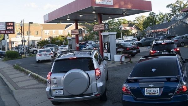 Cars line up for fuel at a gas station in Arlington, Virginia, U.S., May 12, 2021.