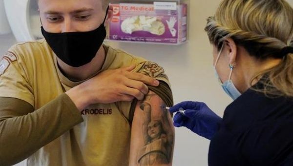 A man gets vaccinated in Paris, France, May 2021.