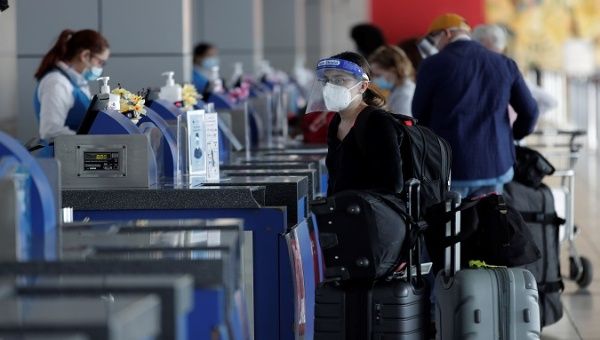 International travelers undergo a check-up at Tocumen International Airport, Panama City, Panama, 2020.