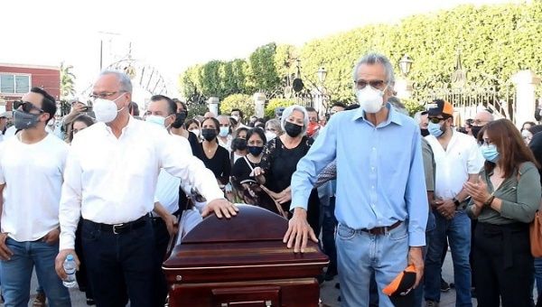 People attend the funeral of Citizens Movement candidate Abel Murrieta, who was assassinated while campaigning, Sonora, Mexico, May. 14, 2021.