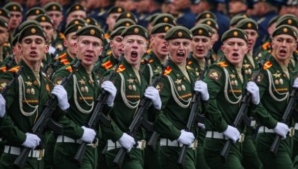Servicemen march during the military parade marking the 76th anniversary of the Soviet victory in the Great Patriotic War on Red Square in Moscow, Russia, May 9, 2021.