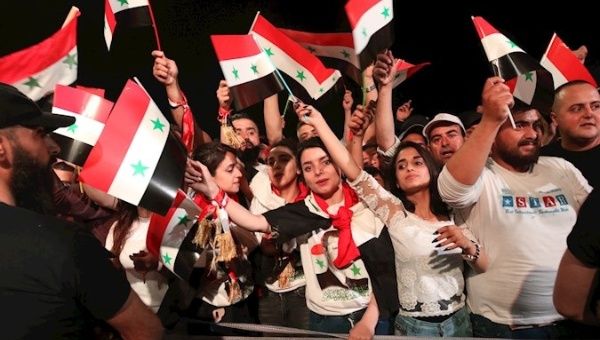 Citizens celebrate Bashar Al Assad’s victory, Damascus, Syria, May 27, 2021.