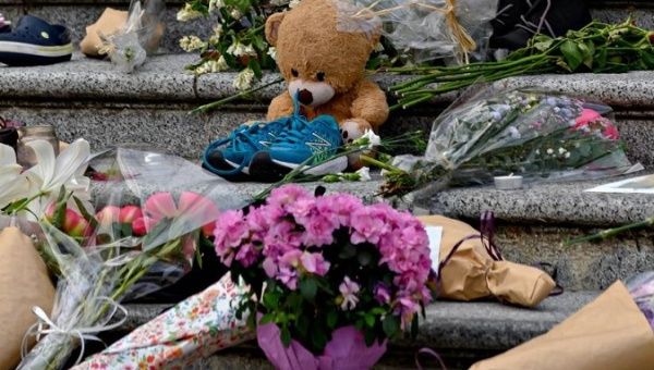 Shoes and toys are placed outside the Vancouver Art Gallery during a memorial event, Vancouver, Canada, May 30, 2021. 