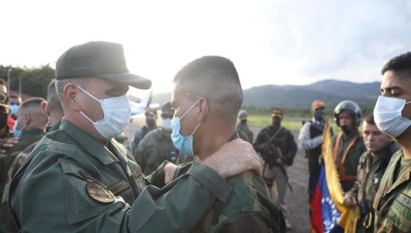 General Vladimir Padrino (L) welcomes abducted soldiers, Apure, Venezuela, May 31, 2021. 