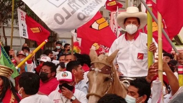 Progressive Peruvian presidential candidate Pedro Castillo riding a horse during a political rally. 