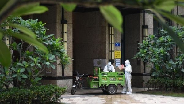 Workers deliver products from online shopping, Guangzhou, China, June 2, 2021. 