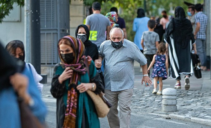 People walk on a street in Tehran, Iran, on June 28, 2021.