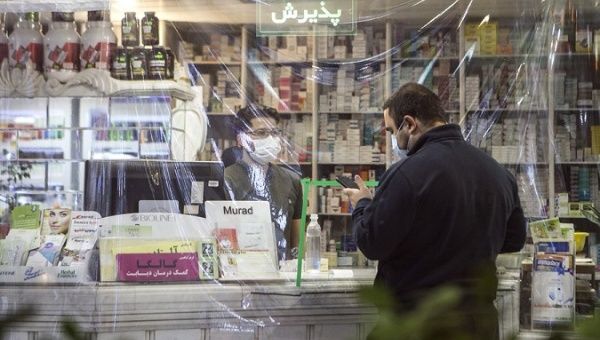 A pharmacy staff member is at work in Mashhad, Iran, Nov. 7, 2020.