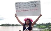 The sign reads, “My Embera-Wera body is not to be touched, beaten, raped, or killed”, Colombia.
