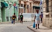 People walk on a street in Havana, Cuba, Aug. 7, 2021.